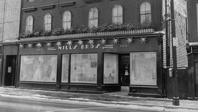 Black and white photo of Mills Bros. building